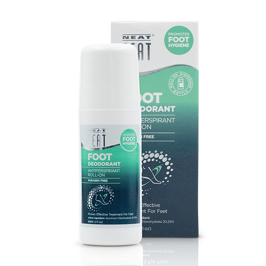 Neat Feat Roll-On Foot Deodorant in a white bottle with a green label and a white cap, with its packaging box displayed in the background.