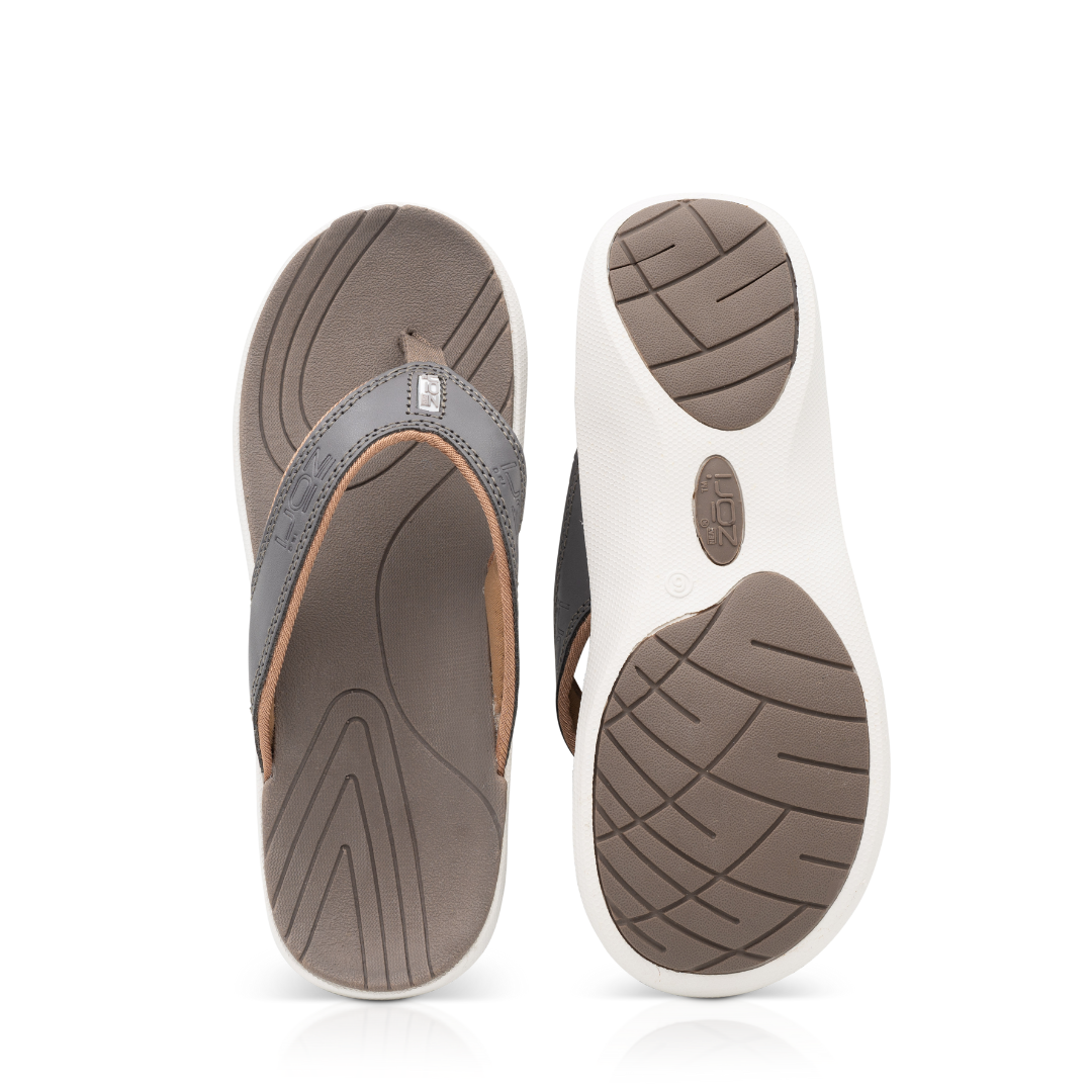 Neat Zori Pewter Slimline Orthotic Thong sandals, top view with one sandal flipped to show its underside, both sandals displayed side by side.