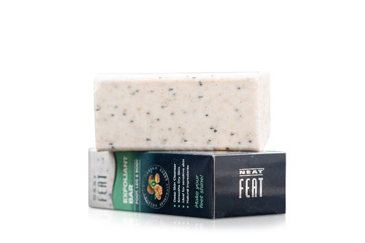 BarS of soap with packaging labeled 'NEAT FEAT' on a clear background